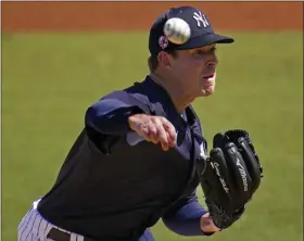  ?? GENE J. PUSKAR — THE ASSOCIAED PRESS ?? New York Yankees pitcher Corey Kluber delivers during the first inning of Saturday’s exhibition game against the Pittsburgh Pirates in Tampa, Fla.