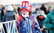  ?? — AFP photo ?? A Trump supporter gestures as he arrives to attend his final Make America Great Again rally of the 2020 US Presidenti­al campaign at Gerald R. Ford Internatio­nal Airport in Grand Rapids, Michigan.