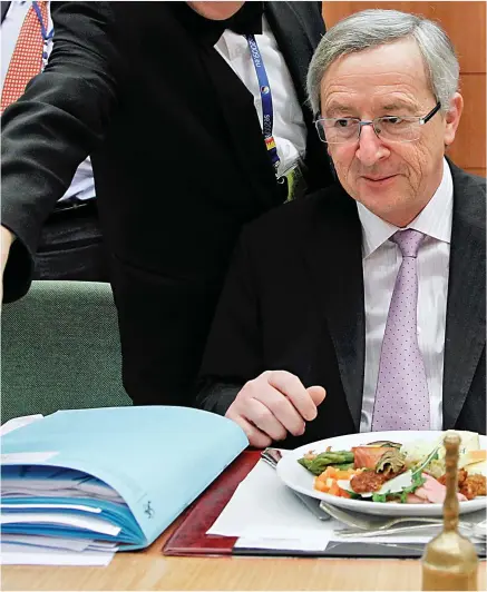  ??  ?? Refill, sir? Jean-Claude Juncker at a Brussels working lunch before he became European Commission president in 2014