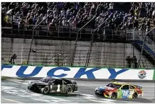  ?? TIMOTHY D. EASLEY / AP ?? Kurt Busch crosses the finish line ahead of Kyle Busch (18) to win the NASCAR Cup Series auto race at Kentucky Speedway in Sparta, Ky., Saturday.