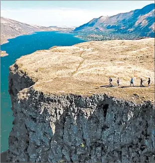  ?? UNCRUISE ADVENTURES ?? Hiking on the Rowena Plateau in Oregon is one of the offerings by UnCruise Adventures.