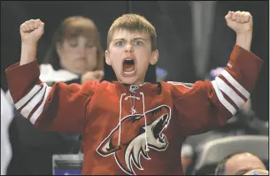  ?? GETTY IMAGES ?? An Arizona Coyotes fan reacts after a goal against the Oilers during the third at Mullett Arena on Thursday. The Coyotes defeated the Oilers 5-2.