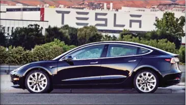  ?? TWITTER ?? A picture of the Tesla Model 3 tweeted by the company’s CEO Elon Musk yesterday. Auto industry analysts are debating how long it will take for fully electric cars to enter the mainstream.