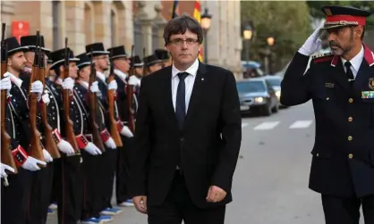  ??  ?? Catalan president Carles Puigdemont and Josep Lluis Trapero Álvarez, chief of the regional police, inspect members of the Mossos d’Esquadra force last week. Photograph: Lluis Gene/AFP/Getty Images