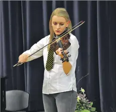  ?? 01_A13concert­04 ?? Megan McNicol plays in the advanced traditiona­l fiddle solo.