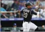  ?? DAVID ZALUBOWSKI - THE
ASSOCIATED PRESS ?? FILE - In this July 29, 2019, file photo, Colorado Rockies’ Ian Desmond follows the flight of his triple off Los Angeles Dodgers starting pitcher Kenta Maeda in the second inning of a baseball game in Denver.