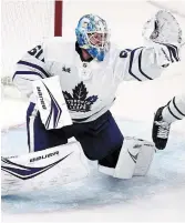  ?? CHARLES KRUPA THE ASSOCIATED PRESS ?? Toronto Maple Leafs goaltender Joseph Woll makes a glove save during the second period of Game 5 of the Leafs’ first-round playoff series against the Boston Bruins on Tuesday.