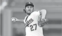  ?? JAE C. HONG/AP ?? Dodgers starting pitcher Trevor Bauer throws against the San Francisco Giants on Monday in Los Angeles.