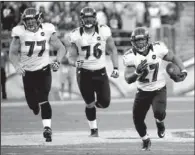  ?? AP/DENNIS POROY ?? Baltimore Ravens running back Ray Rice (right) set up the Ravens’ game-tying field goal with a 30-yard run against the San Diego Chargers in the fourth quarter Sunday in San Diego.