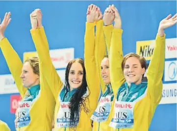  ??  ?? Team Australia poses with the bronze medal during the podium ceremony for the women’s 4x100m medley relay swimming event at the 2015 FINA World Championsh­ips in Kazan.