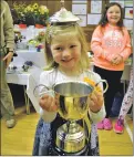  ?? 26_t36bend1 ?? PRIZE PUPILS: a happy Eva Reeves collected the challenge cup for best school entry in flowers and vegetables on behalf of Barcaldine primary school