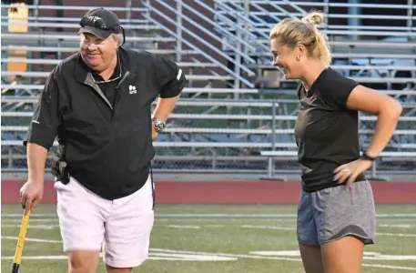  ?? CHRiS CHRiSto pHotoS / HeRald Staff ?? ALL IN THE FAMILY: Dover-Sherborn field hockey father/daughter coaching duo Thom and Molly McGill are seen during practice last week.