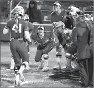  ?? Special to the Democrat-Gazette/KEVIN SNYDER ?? University of Arkansas sophomore Danielle Gibson is greeted at the plate after one of her four home runs in Saturday’s 15-3 victory over Southern Illinois-Edwardsvil­le in Fayettevil­le.