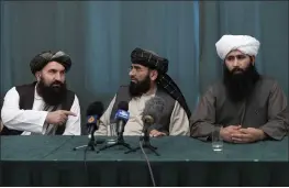  ?? ALEXANDER ZEMLIANICH­ENKO — THE ASSOCIATED PRESS ?? Members of the Taliban from the left, Khairullah Khairkhwa, Suhail Shaheen and Mohammad Naeem attend a joint news conference in Moscow on Friday.