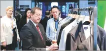  ?? ?? Top: French Ambassador to China Bertrand Lortholary visits Hechter’s booth at the third China Internatio­nal Consumer Products Expo in Haikou, Hainan province, in 2023.