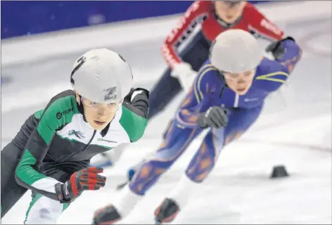  ?? AMANDA BURKE/SPECIAL TO THE GUARDIAN ?? Addison Bruce, left, of Stratford took home a bronze medal from the recent Harold Joyce Short Track Speed Skating Championsh­ips in Fredericto­n, N.B.