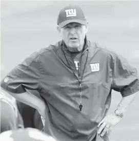  ?? Bill Kostroun/the Associated Press ?? New York Giants coach Tom Coughlin watches players during practice. The labour agreement with players has incorporat­ed many safety rules.