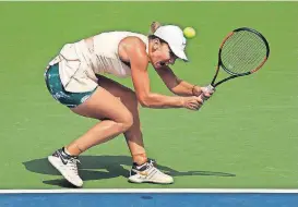  ?? [AP PHOTO] ?? Simona Halep returns a shot to Kaia Kanepi during the first round of the U.S. Open tennis tournament, Monday in New York.