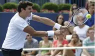  ?? AL BEHRMAN/THE ASSOCIATED PRESS ?? Canadian Milos Raonic failed to make his second straight quarter-final appearance after losing to American John Isner 7-6 (5), 6-4 on Thursday.