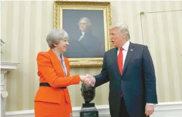  ?? — Reuters ?? US President Donald Trump meets with British Prime Minister Theresa May in the White House Oval Office in Washington on Friday.