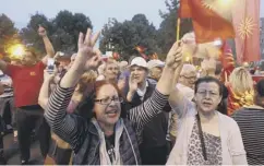  ??  ?? 0 People protest against Macedonia’s proposed name change