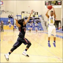  ?? Photo courtesy of JBU Sports Informatio­n ?? John Brown University sophomore Brandon Joseph shoots a 3-pointer in the second half Saturday against St. Gregory’s in the Golden Eagles’ 77-64 victory. Joseph scored 23 points as the Golden Eagles improved to 11-8 overall and 3-5 in the Sooner...