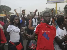  ??  ?? Supporters of former soccer player George Weah, presidenti­al candidate for the Coalition for Democratic Change, celebrate, in Monrovia, Liberia on Friday. The National Election Commission has declared George Weah president-elect and Jewel Howard-Taylor...