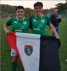  ??  ?? Mark Nicholson (left) and Paddy McKenzie with a WRFC flag after the final whistle.