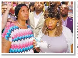  ??  ?? Eric Garner’s mother, Gwen Carr (r.), and her daughter Alicia stand with crowd at City Hall Tuesday after feds’ announceme­nt. Black Lives Matter leader Hawk Newsome (top) had gone to D.C. to press case.