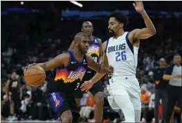  ?? MATT YORK — THE ASSOCIATED PRESS ?? Suns guard Chris Paul (3) drives to the basket against Mavericks guard Spencer Dinwiddie (26) during the second half of Game 2 on Wednesday in Phoenix.