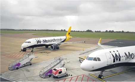  ?? Picture: PA. ?? Monarch planes grounded at Luton Airport after the airline collapsed into administra­tion.