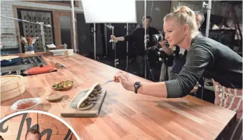 ?? PHOTOS BY ROBERT HANASHIRO, USA TODAY ?? Food stylist Hayley Christophe­r and camera operator Peter Lau work on a video shoot in the Tastemade studios.