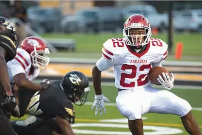  ?? Staff photo by Evan Lewis ?? n Arkansas High running back Tyrie Black puts on the brakes as the Pleasant Grove defense closes down the weak side during Friday's season opener at Hawk Stadium. PG held on to beat the Razorbacks, 27-20.