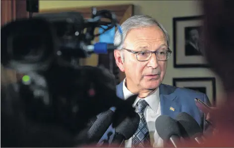  ?? CP PHOTO ?? New Brunswick Progressiv­e Conservati­ve Leader Blaine Higgs speaks to the media following the throne speech at the New Brunswick legislatur­e in Fredericto­n this week.