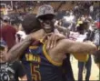  ?? FRANK GUNN — THE CANADIAN PRESS VIA AP ?? Cleveland Cavaliers forward LeBron James celebrates a win over the Toronto Raptors with J.R. Smith.
