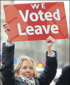  ?? AP ?? A pro-brexit protester waves a placard outside the British Parliament in London on Tuesday.