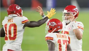  ?? AP ?? Tyreek Hill celebrates with Patrick Mahomes after a 20-yard touchdown reception in the second quarter.