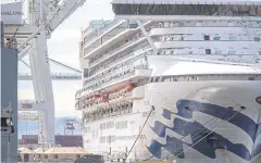  ?? REUTERS ?? Medical personnel tend to passengers as they disembark from the ‘Grand Princess’ cruise ship at the Port of Oakland in California on Monday.