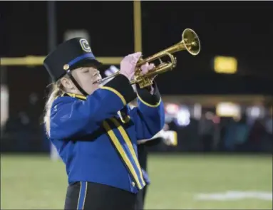  ?? JEN FORBUS — THE MORNING JOURNAL ?? Clearview High School senior Elizabeth Gunter, 17, performs a solo during Beatles tune “Eleanor Rigby” on Oct. 27, at the Clearview football stadium.