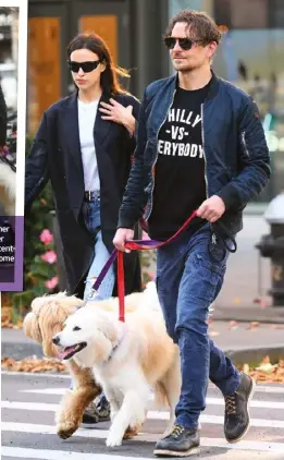  ?? ?? ABOVE and RIGHT: Former lovebirds Bradley Cooper and Irina ⬛hayk were recently spotted indulging in some PDA while walking their dogs in New York.