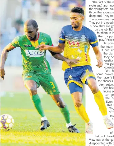  ?? NICHOLAS NUNES ?? Timar Lewis (right) of Harbour View FC tackles Xavian Virgo of Humble Lion during their Jamaica Premier League quarterfin­al second-leg match at Sabina Park on Monday.