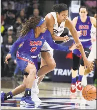  ?? Jessica Hill / Associated Press ?? UConn’s Napheesa Collier, right, steals the ball from SMU’s Ariana Whitfield during the first half of Wednesday’s 79-39 win in Storrs.