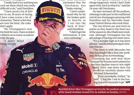  ?? ?? Red Bull driver Max Verstappen arrives for the podium ceremony of the Saudi Arabian Grand Prix in Jeddah on Sunday. AFP PIC