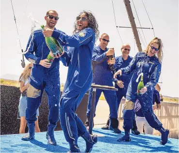  ?? ROBERTO E. ROSALES/JOURNAL ?? Virgin Galactic Astronaut Sirisha Bandla sprays her crewmates with champagne Sunday after returning to Earth aboard VSS Unity on Sunday.