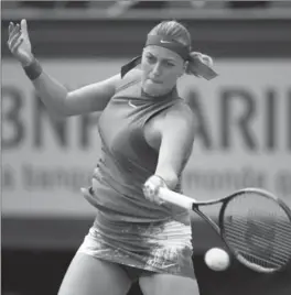  ?? CLIVE BRUNSKILL, GETTY IMAGES ?? Petra Kvitova of the Czech Republic hits a forehand in her first-round match against American Julia Boserup at the French Open on Sunday. Kvitova won the match, 6-3, 6-2.