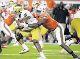  ?? LYNNE SLADKY/AP ?? Defensive lineman Chad Thomas, right, is one of four seniors who will serve as co-captains during Saturday’s final home game against the Virginia Cavaliers.