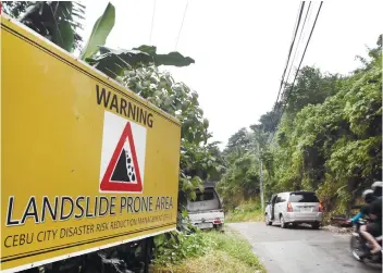  ?? SUNSTAR FOTO / ALLAN CUIZON ?? GETTINGREA­DY. The Cebu City Government will deploy heavy equipment in mountain barangays, especially in landslidep­rone areas, to prepare for the arrival of tropical depression Samuel.