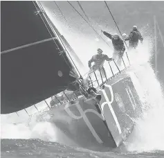  ??  ?? The crew aboard the yacht Perpetual Loyal react as they hit a wave sailing out of Sydney Harbour during the start of the annual Sydney to Hobart Yacht race, Australia’s premiere bluewater classic, in Australia. — Reuters photo