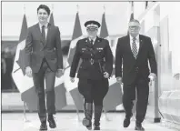  ?? CP PHOTO ?? Brenda Lucki, center, Prime Minister Justin Trudeau, left, and Ralph Goodale, minister of public safety and emergency preparedne­ss enter a press event at RCMP “Depot” Division in Regina, Saskatchew­an on Friday March 9, 2018. Lucki, who was Depot’s...