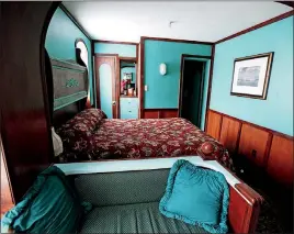  ??  ?? A room meant to resemble a steamboat cabin at the historic Lafayette hotel